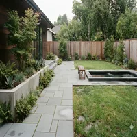 Modern backyard concrete and stone design